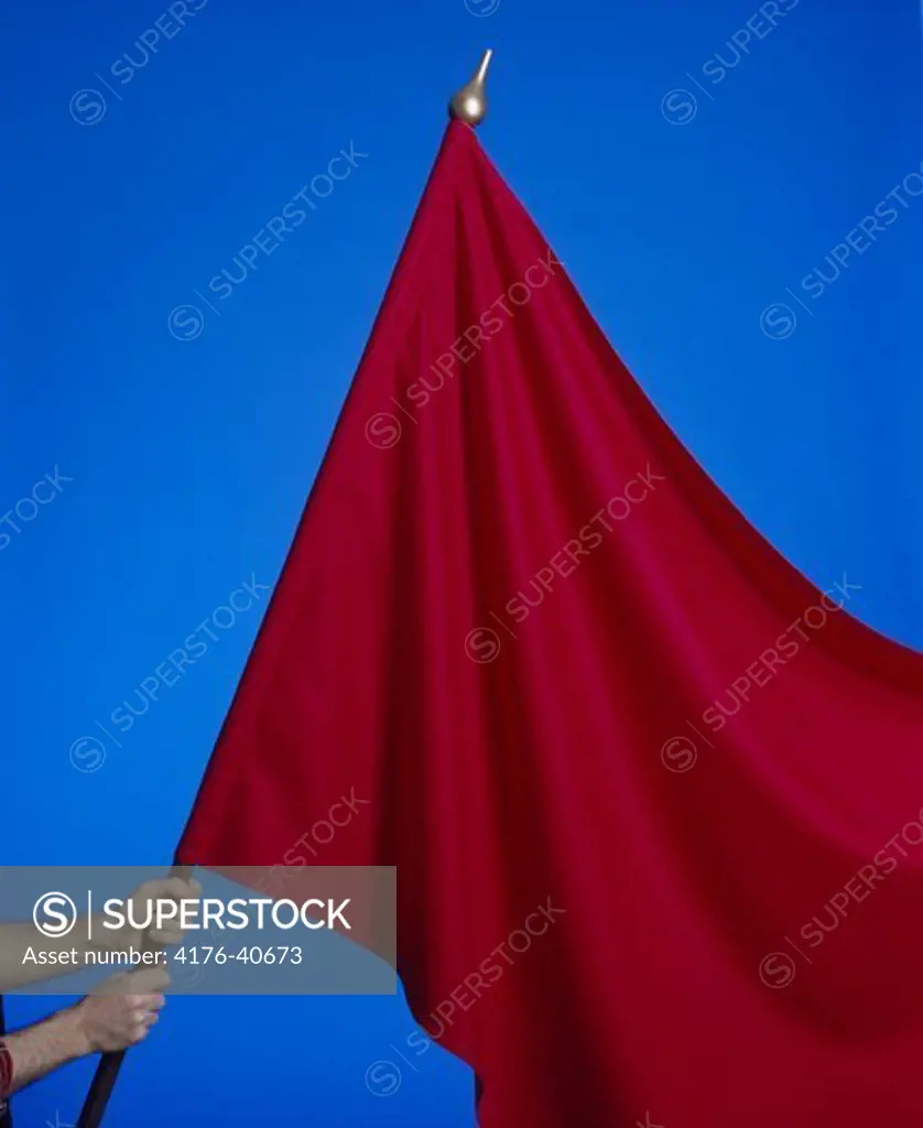 A red flag against blue background