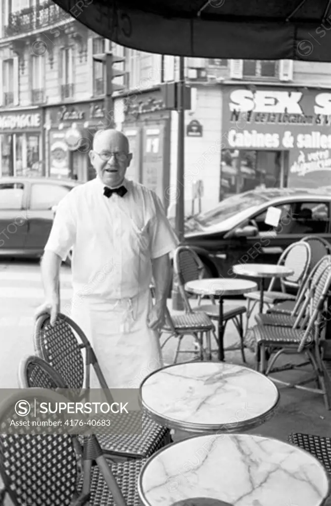 A waiter near Moulin Rouge in Paris