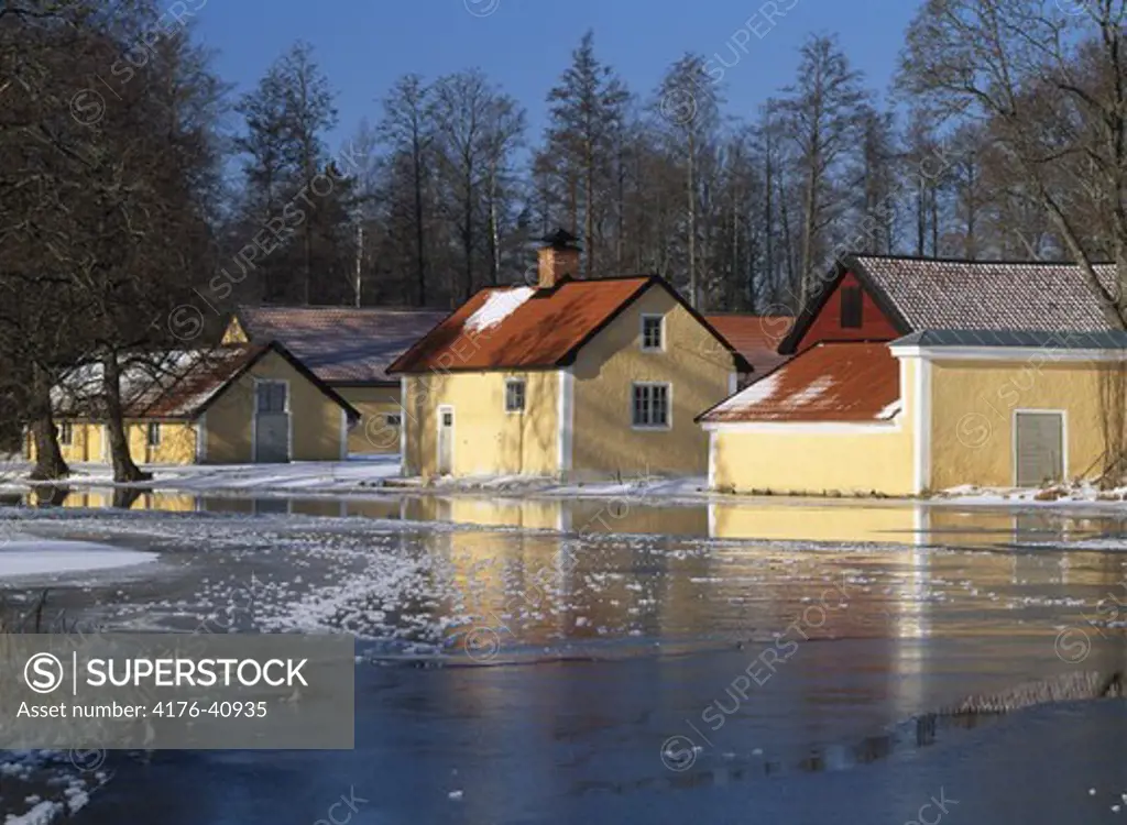 Houses by a frozen lake, Sweden
