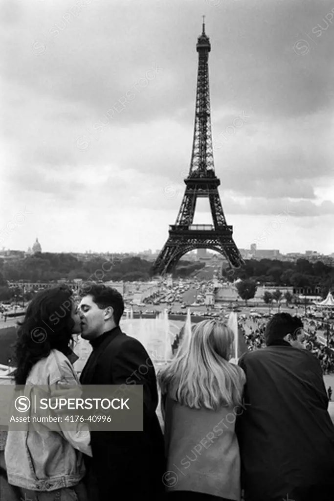 Lovers against the Eiffel Tower in Paris