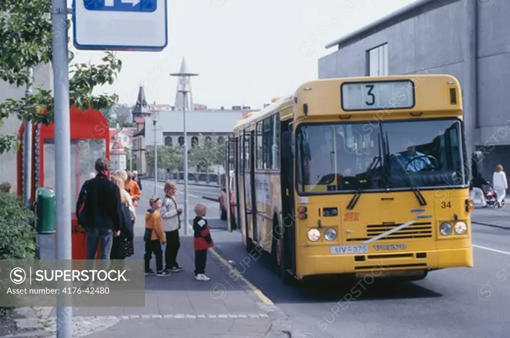 A bus picking up passengers