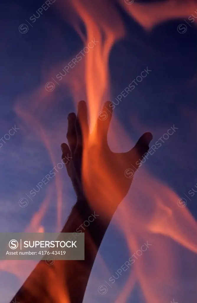 A hand and a flame