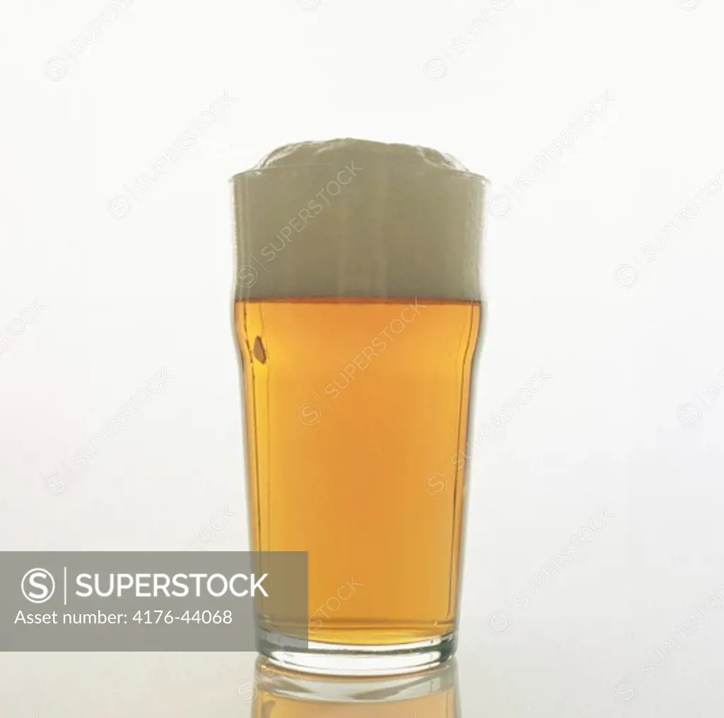 Foam topped glass of beer