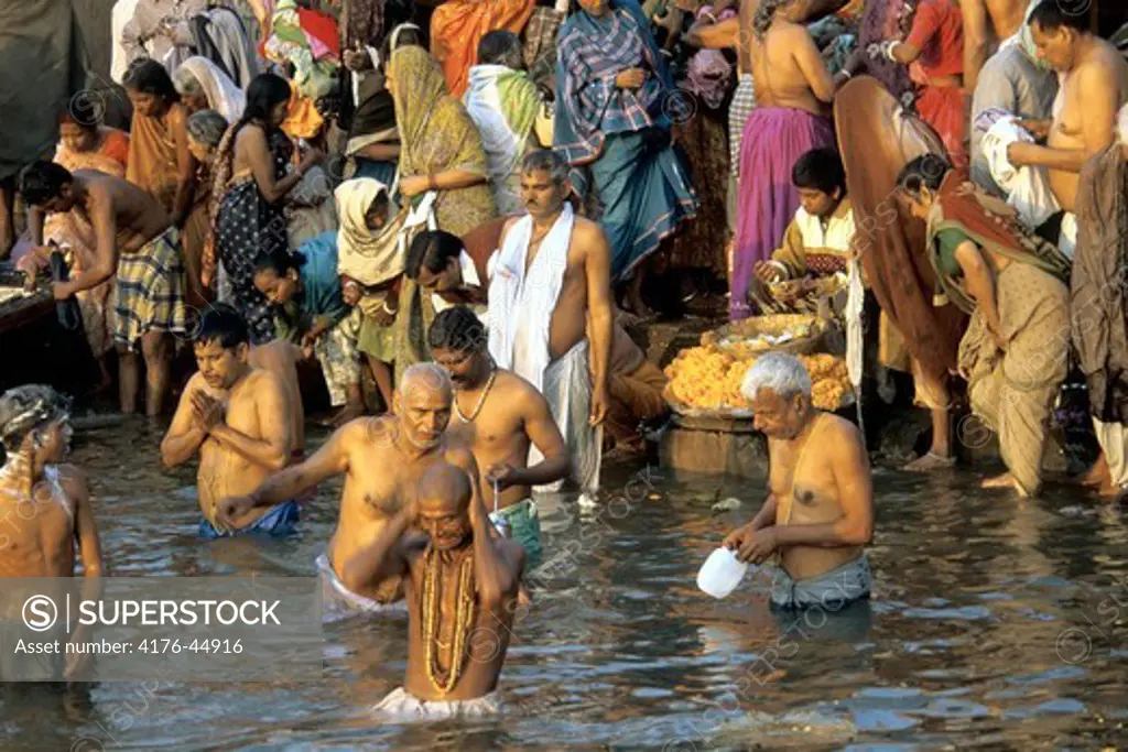 People taking a religious bath on Khumb Festival in the river ganga at Haridwar, India