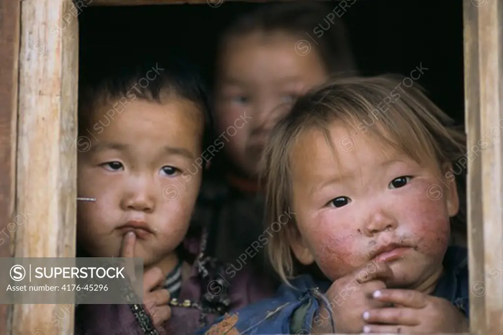 Close up of three children in Mongolia, Asia