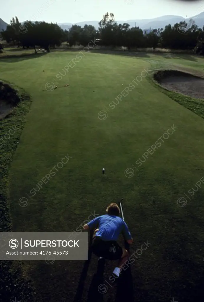 Person playing golf at a golf course