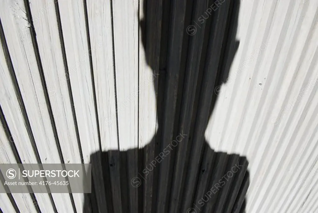 Weird looking shadow of Martin Lladó on wooden door, Copenhagen, Denmark.