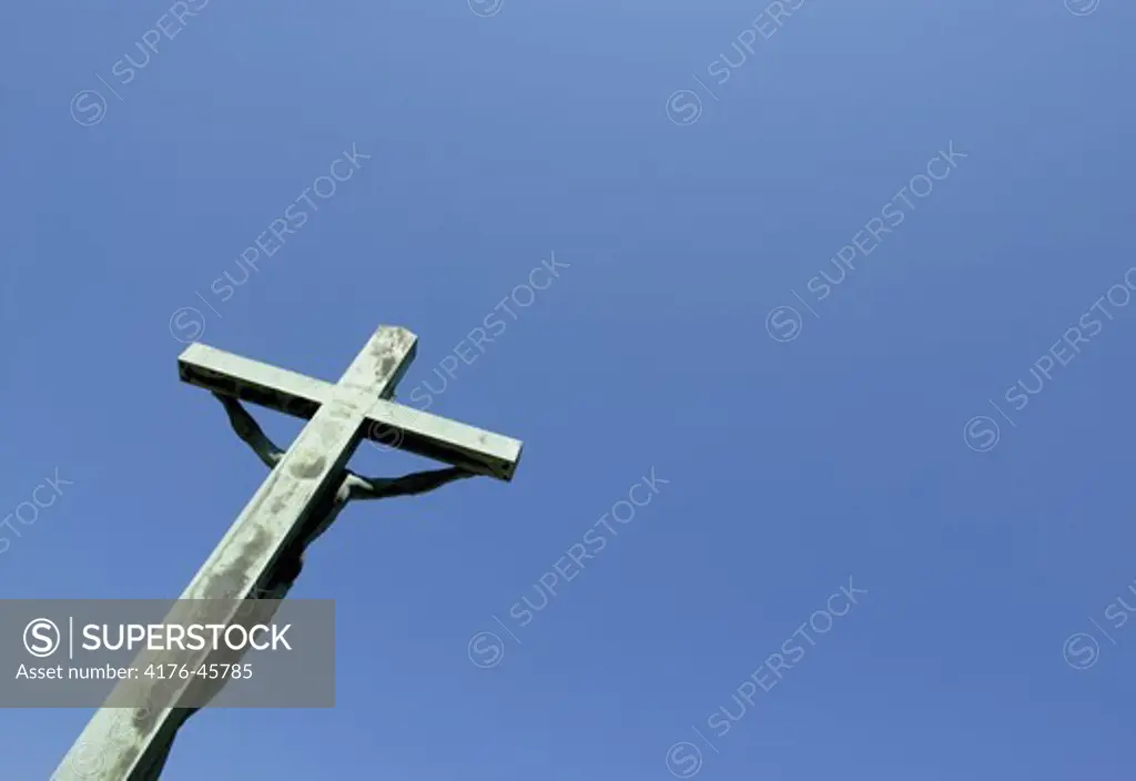 Jesus on cross in front of Jesuskirken in Valby, Copenhagen, Denmark.