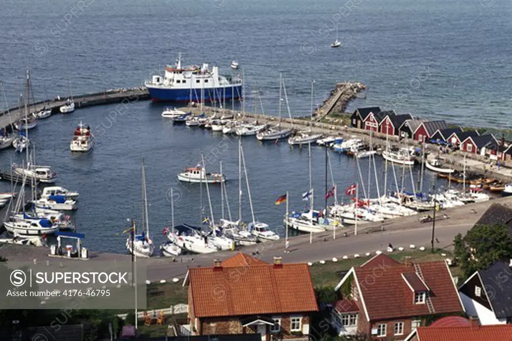High angle view of harbour with houses and sailboats