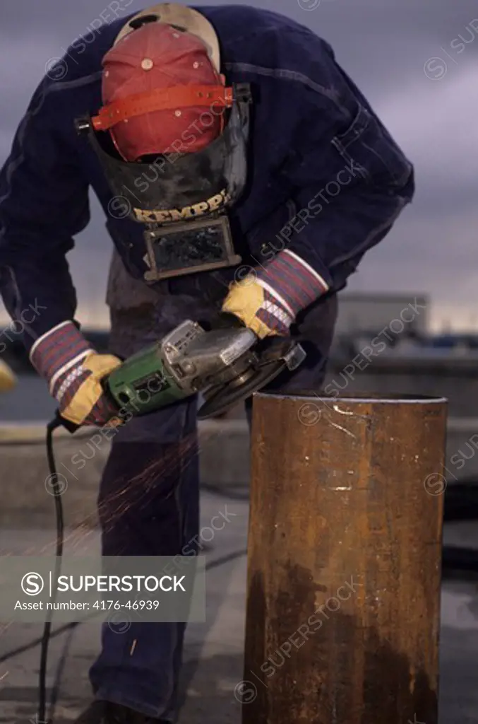 A person working with an electric cutter