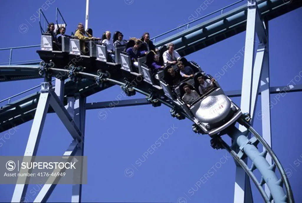 People riding in the roller coaster