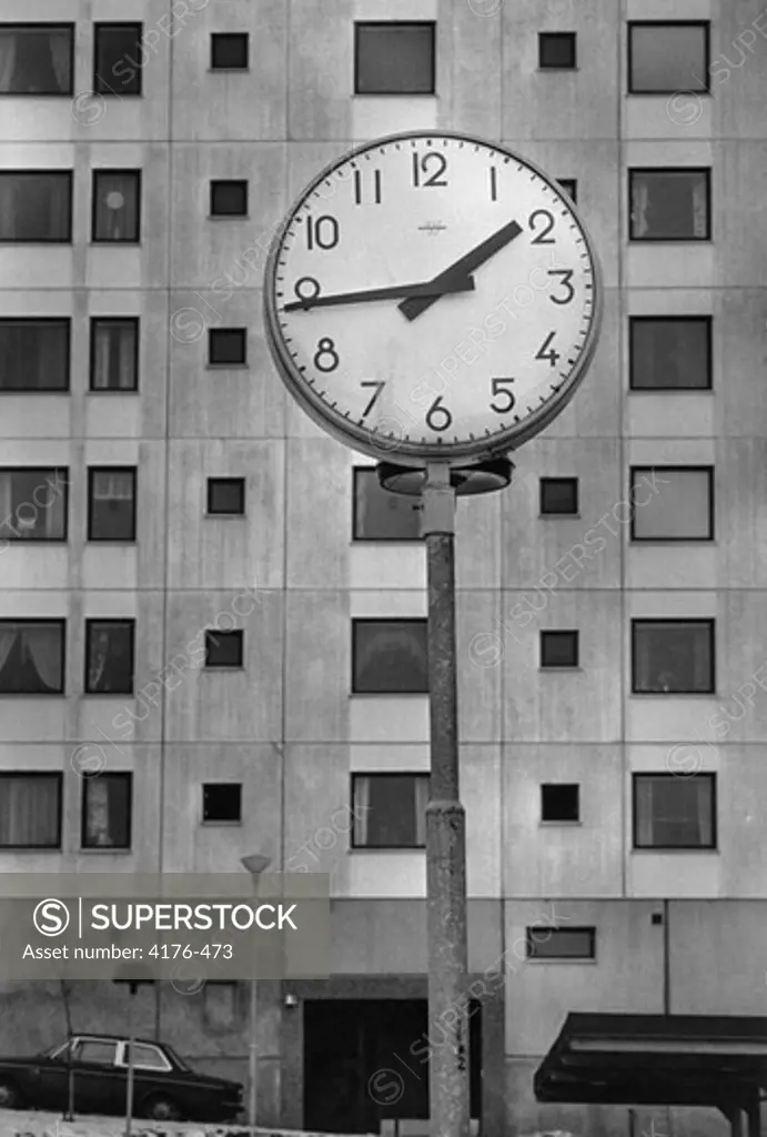 Clock in front of an apartment