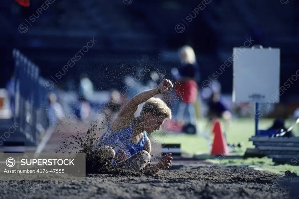 Long jump athlete fallen in sandpit