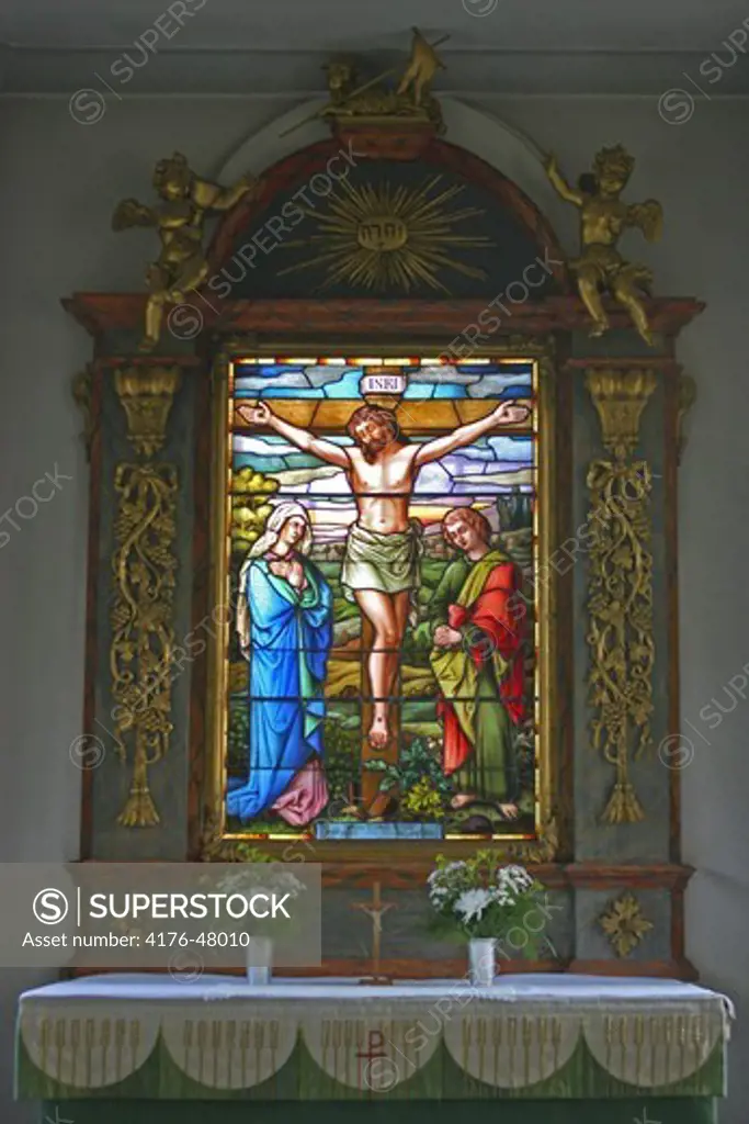 Stained glass window in church showing Jesus Christ