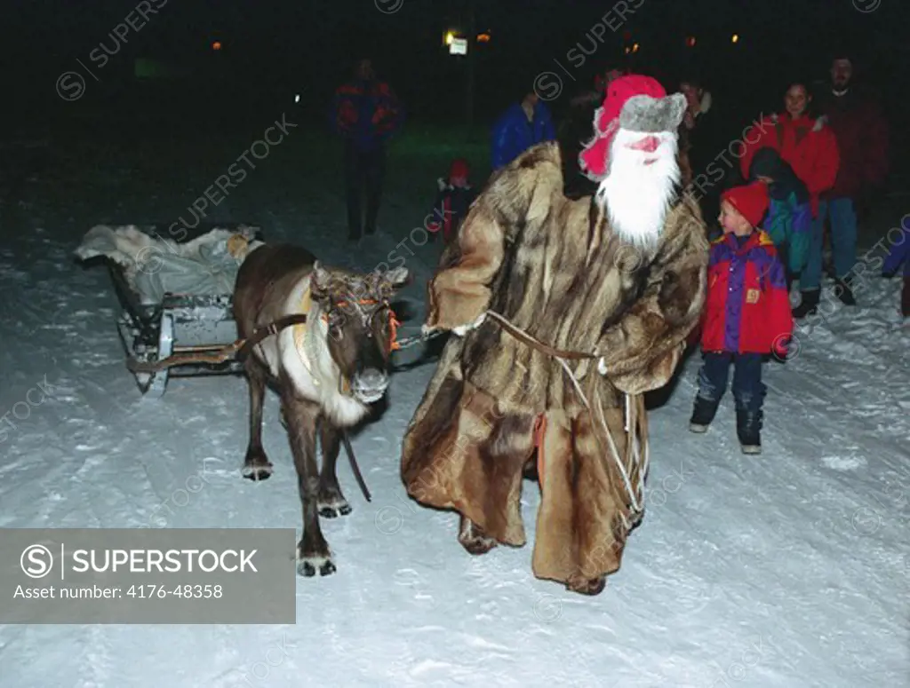 Santa Claus with a reindeer is coming on christmas. Sweden.