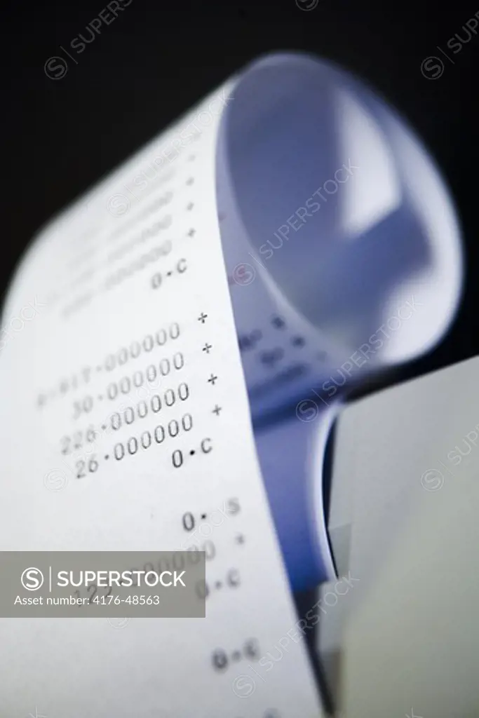 A roll of paper coming out of a calculator