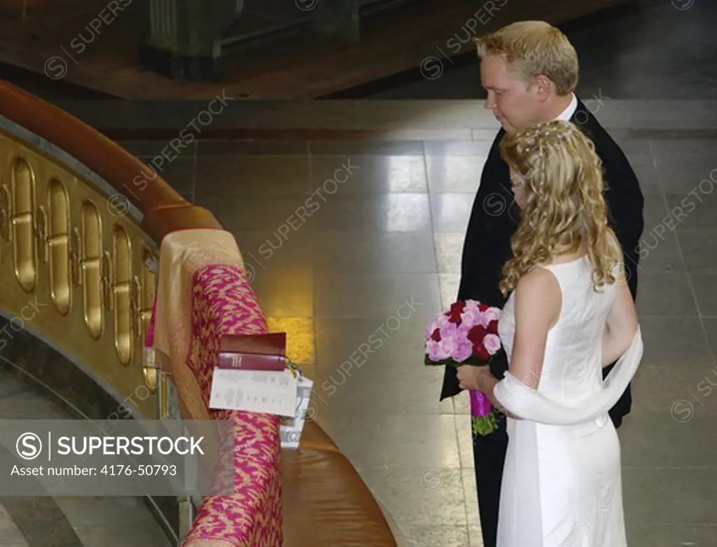 Bridal couple by the altar. Hedvig Elenora church.