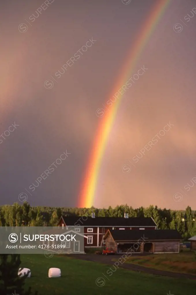 Farm under rainbow