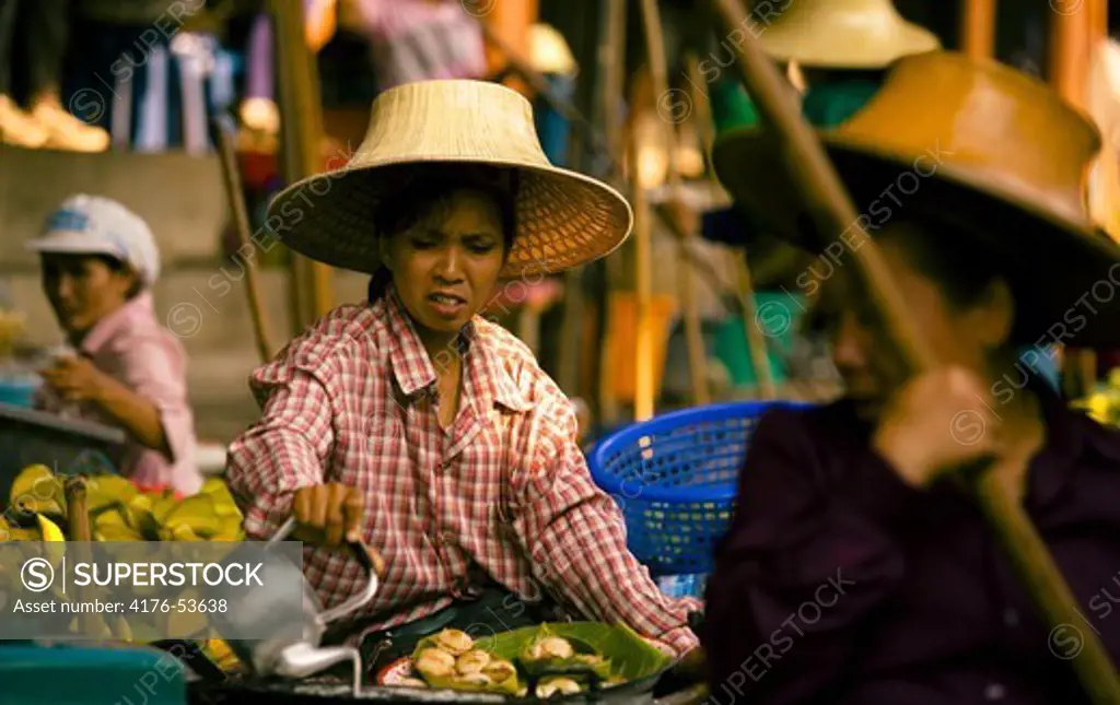 Native woman at the local rivermarket in Thailand.
