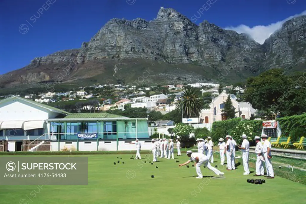 Lawn bowling club members at Camps Bay in Cape Town South Africa below Table Mountain
