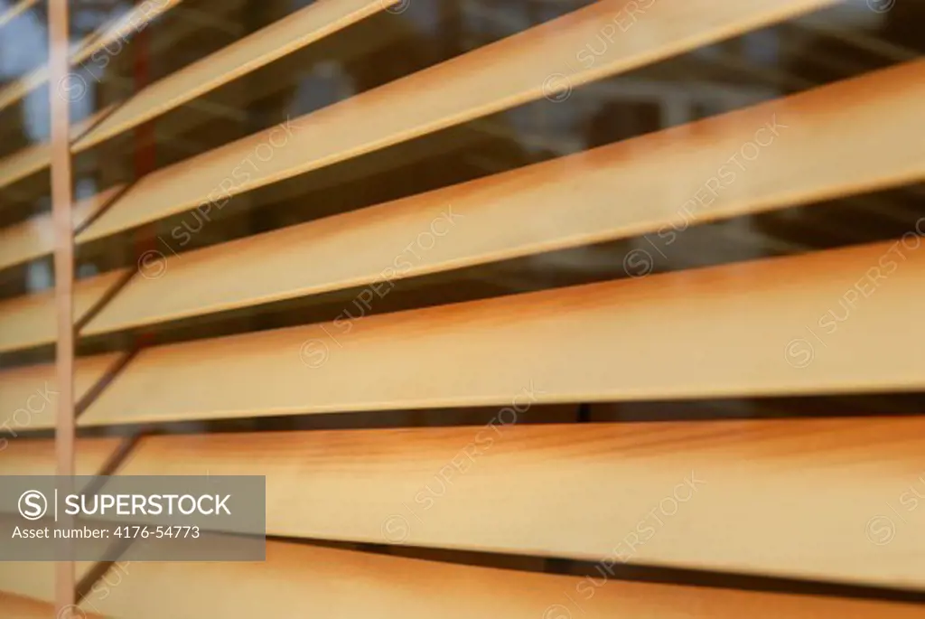 Wooden blinds in a window.