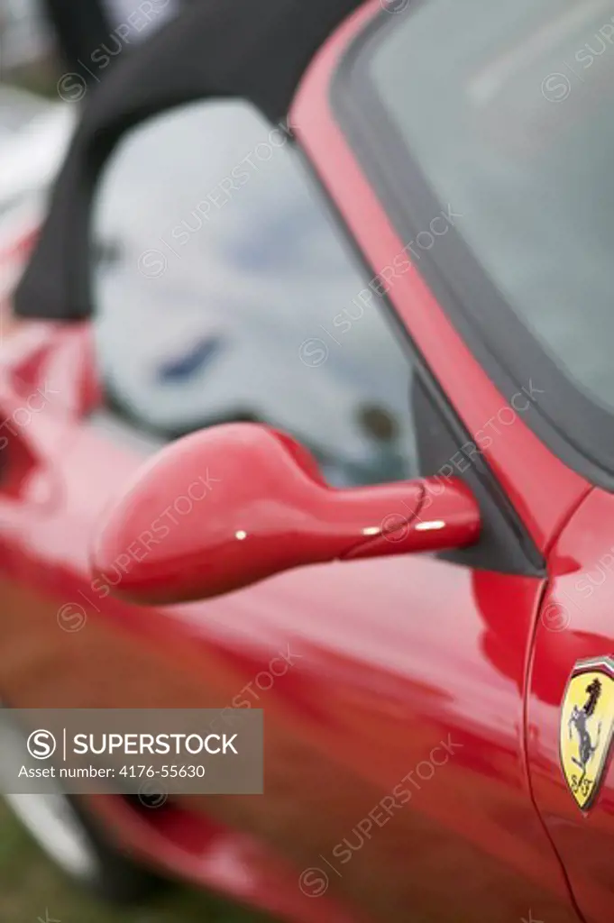 Detail picture of a red classic Ferrari.