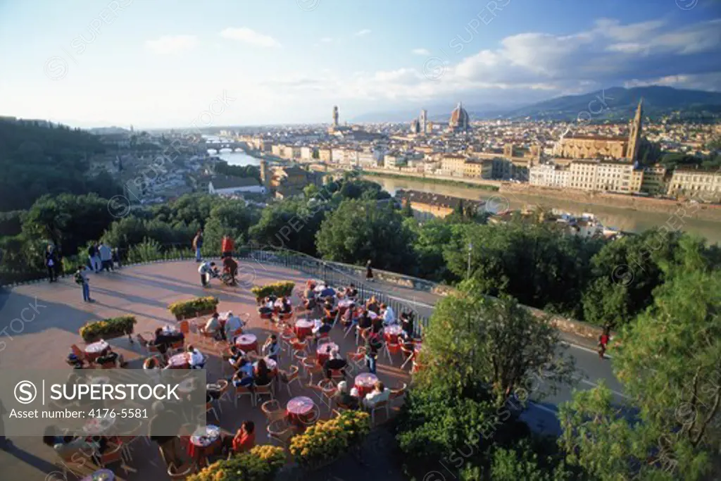 Outdoor cafe at Piazzale Michelangelo above Florence and Arno River near sunset