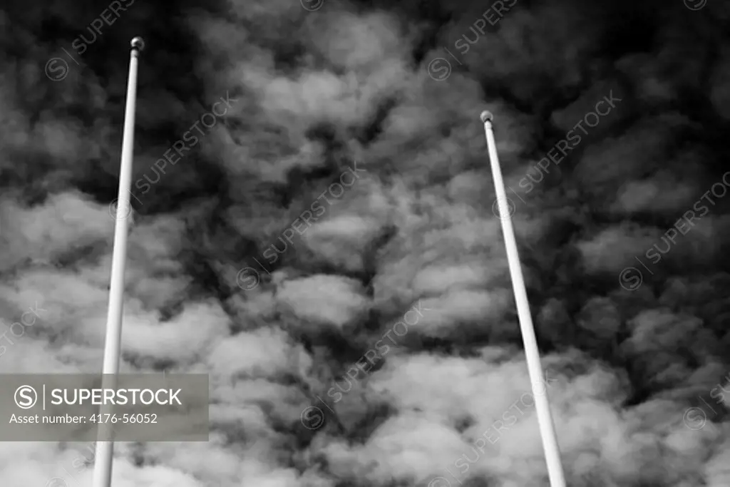 Two flag poles against the sky, Sweden.