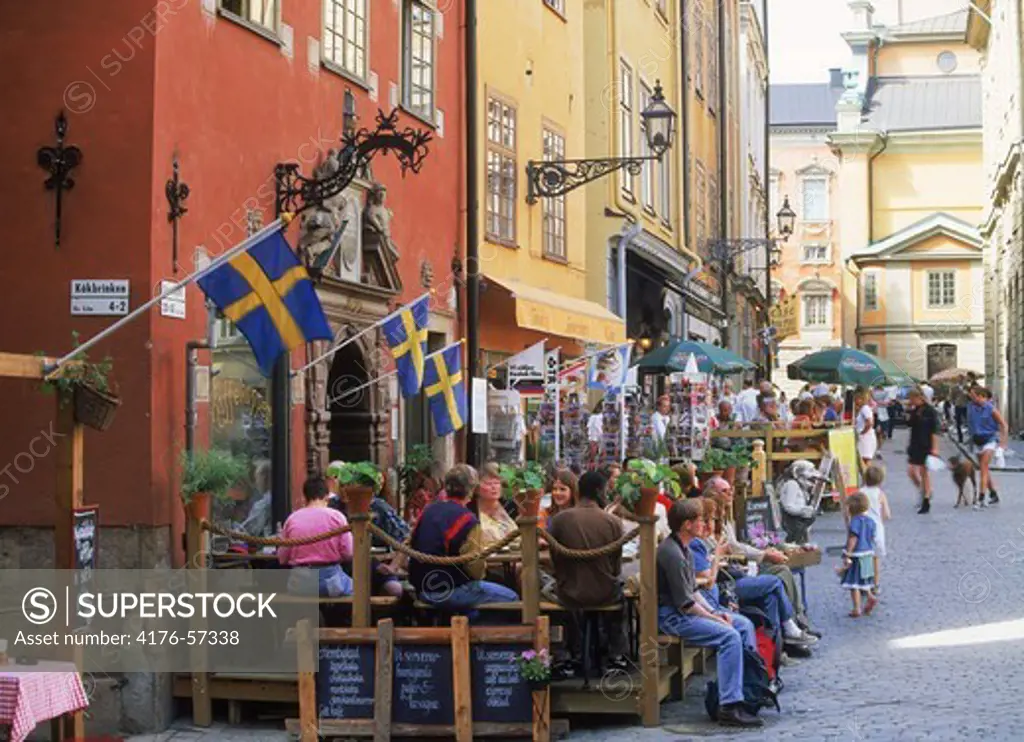 People at sidewalk cafes and restaurants at Stortorget square in the Old Town of Stockholm