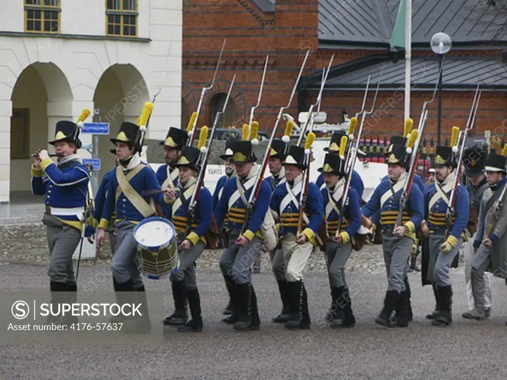 Marching soldiers in ancient uniforms from 1808-yea