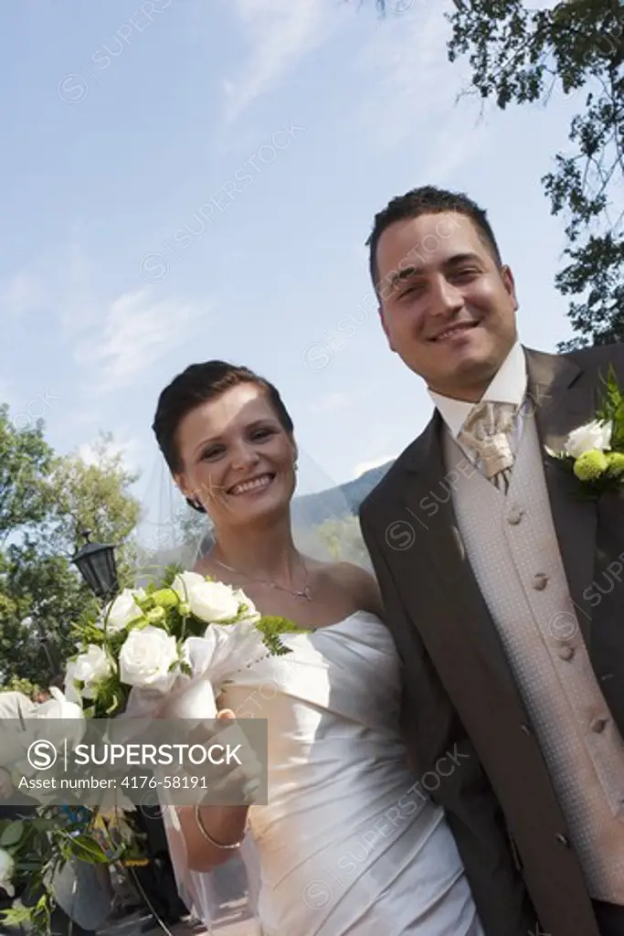 Young married couple smiling.