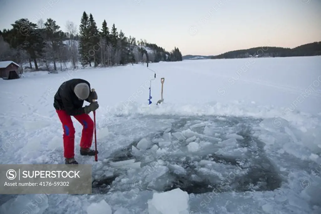 Breaking ice, Jamtland, Sweden