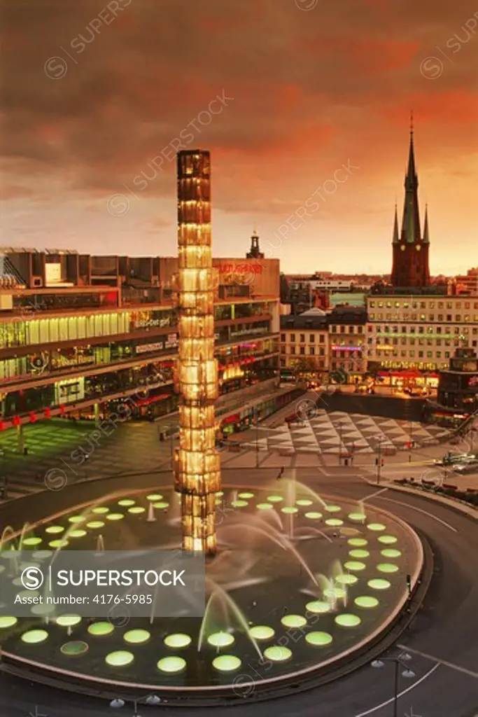 Sergels Torg Fountain and House of Culture or Kulturhuset in Stockholm at dusk