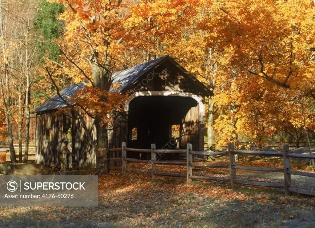 Old covered bridge amid fall foliage near Grafton, Vermont in New England