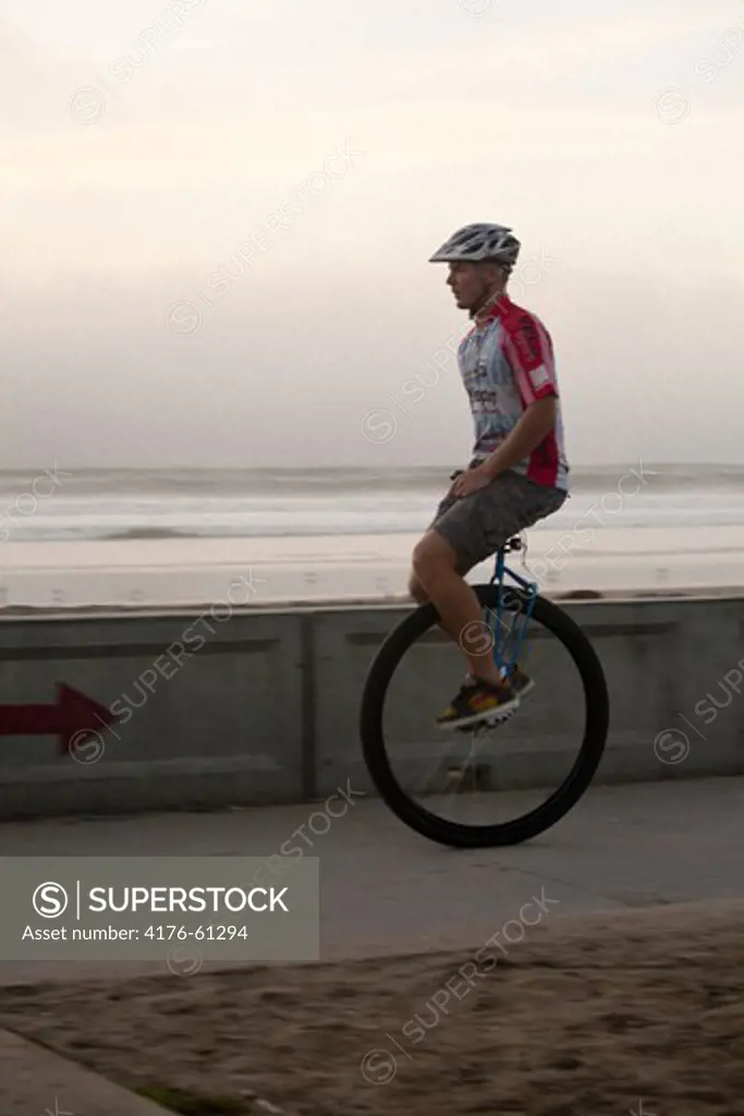 Guy on one wheel, San Diego, California, USA