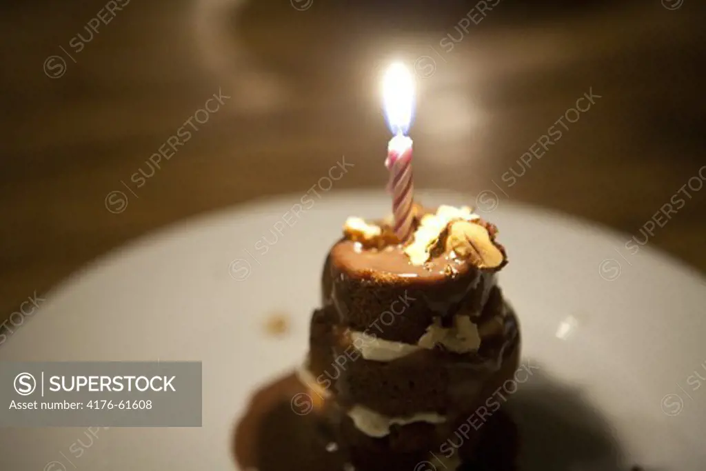 Cake with one burning candle, Toulouse, France