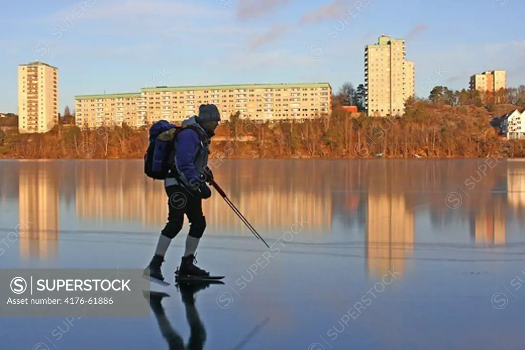Person skating on a frozen lake, Sodermanland, Sweden