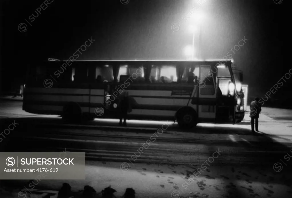 A stopped bus at night