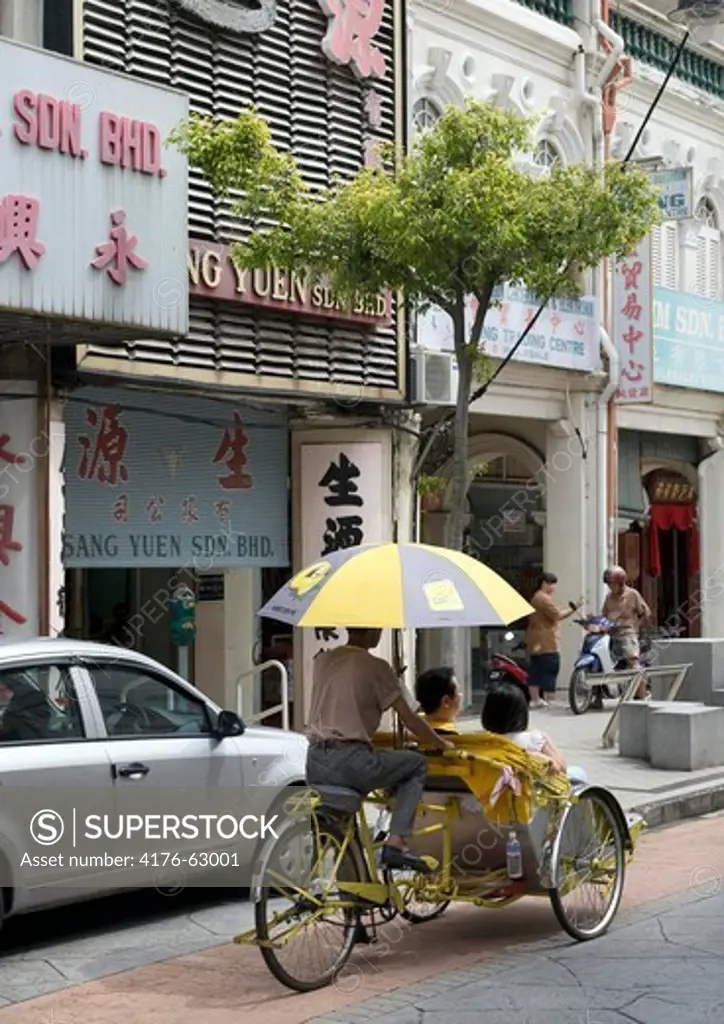 Tourists on a trishaw ride, Georgetown, Penang Malaysia