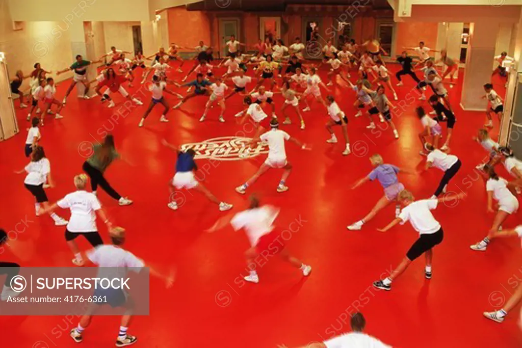 Group aerobic gym class exercising in Stockholm Sweden