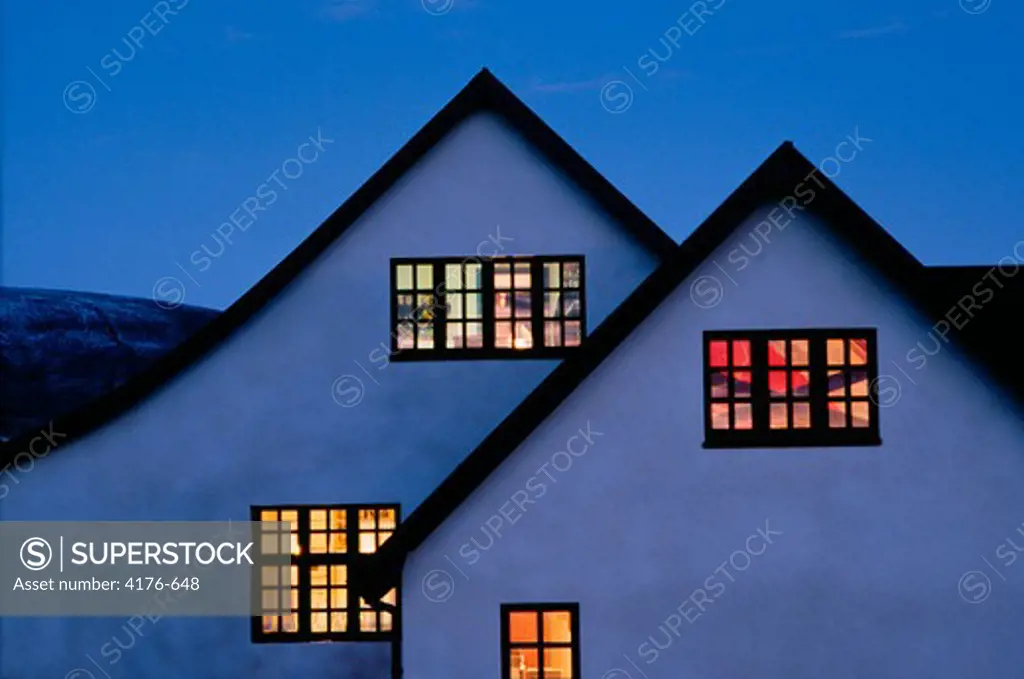 Low angle view of a house lit up at dusk, Iceland