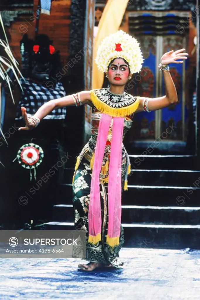 Indonesian woman in traditional dance costume and pose