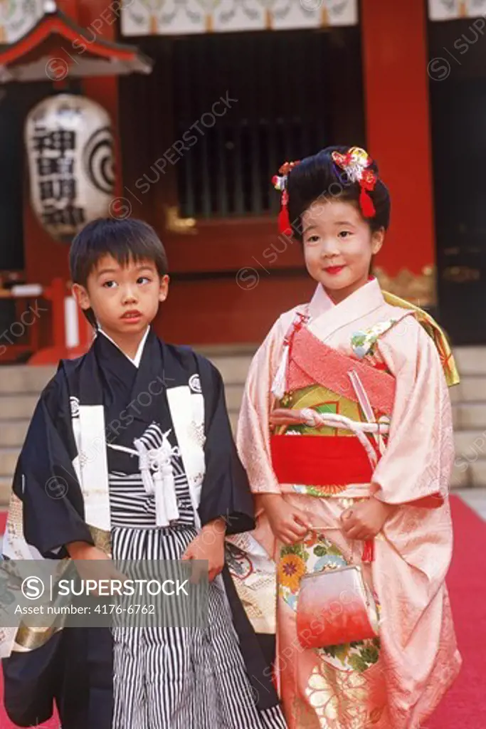 Japanese boy and girl in kimonos during childrens festival