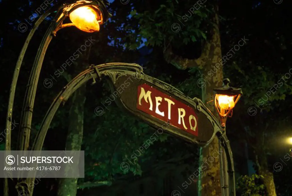 Low angle view of a signboard lit up at night, France