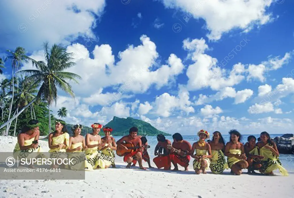 Traditional island dress of French Polynesians on Bora Bora beach