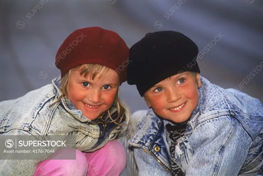 Brother and sister wearing winter hats