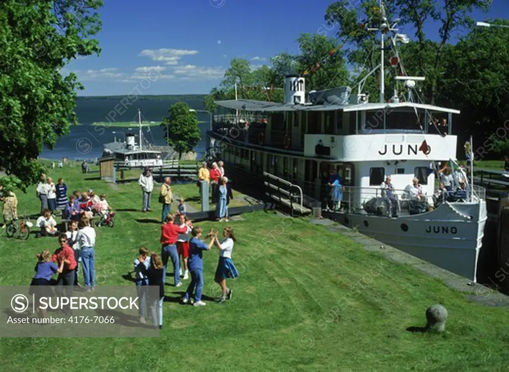 Gota Canal steamer at Berg locks in Sweden with passengers dancing or relaxing