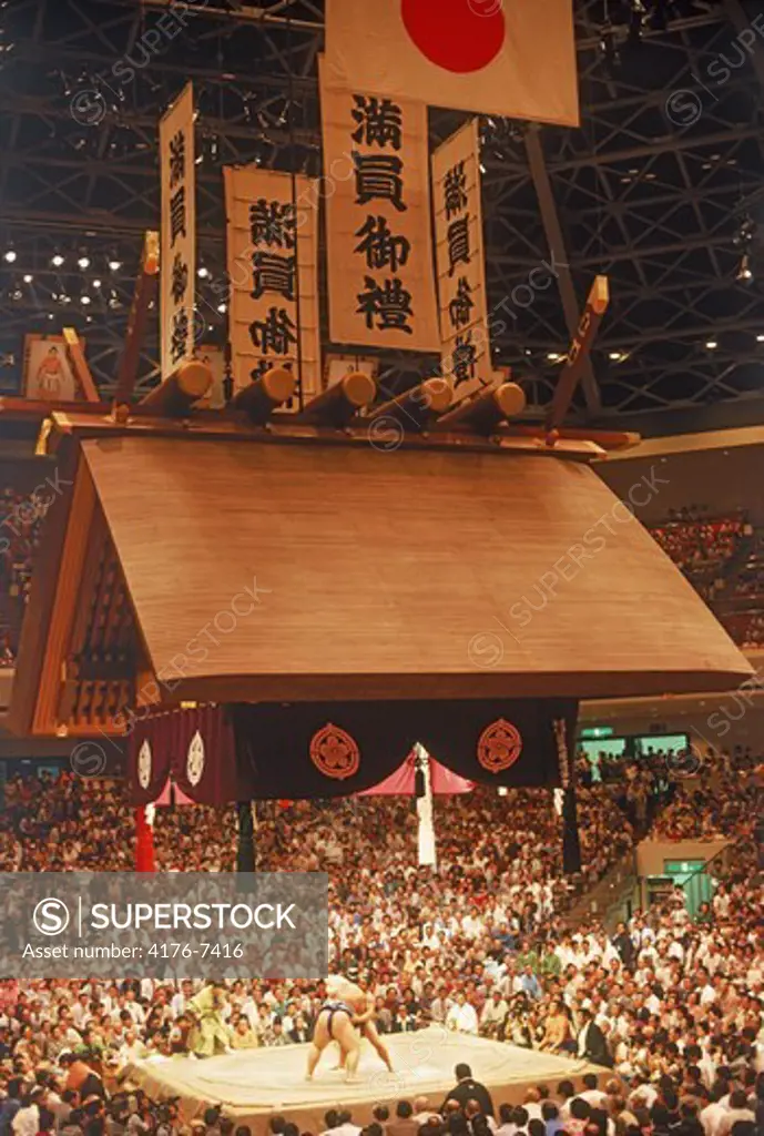 Sumo wrestling ring under Shinto shrine roof in Tokyo