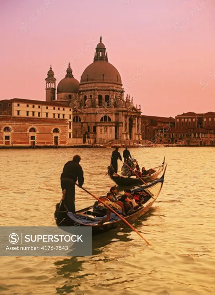 Gondola with Santa Maria dell Salute in Venice at sunset