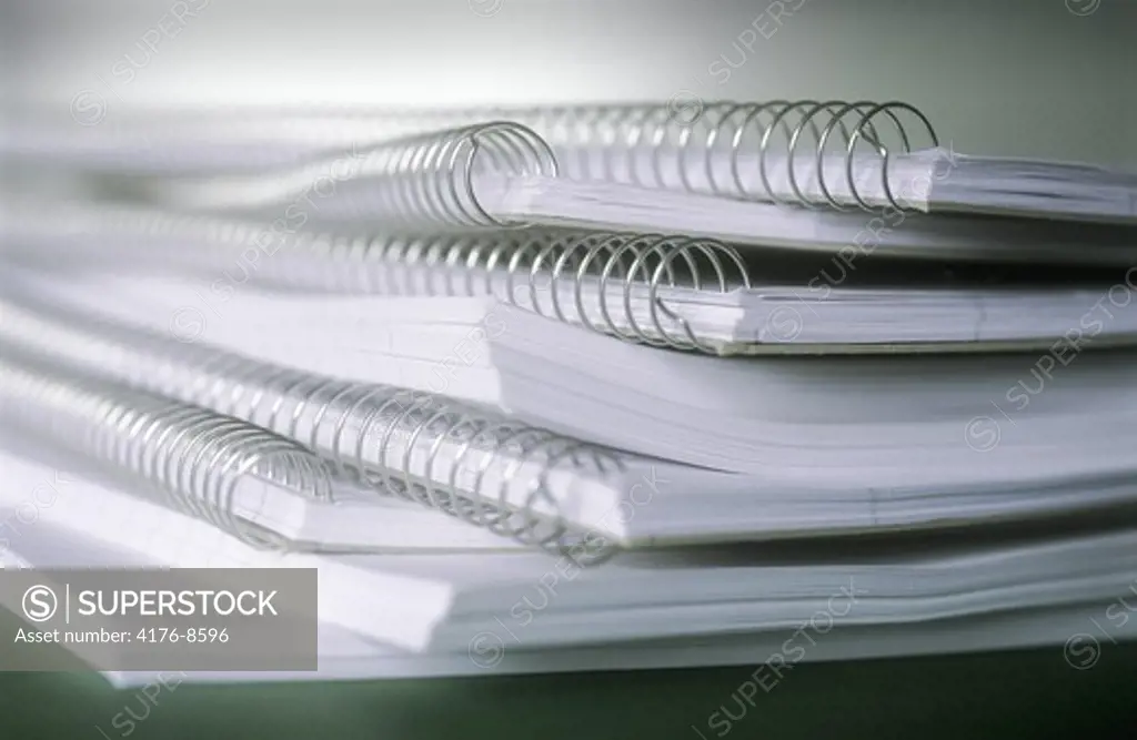 STACK OF NOTEBOOKS